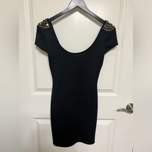 Black round neck dress with studded shoulders